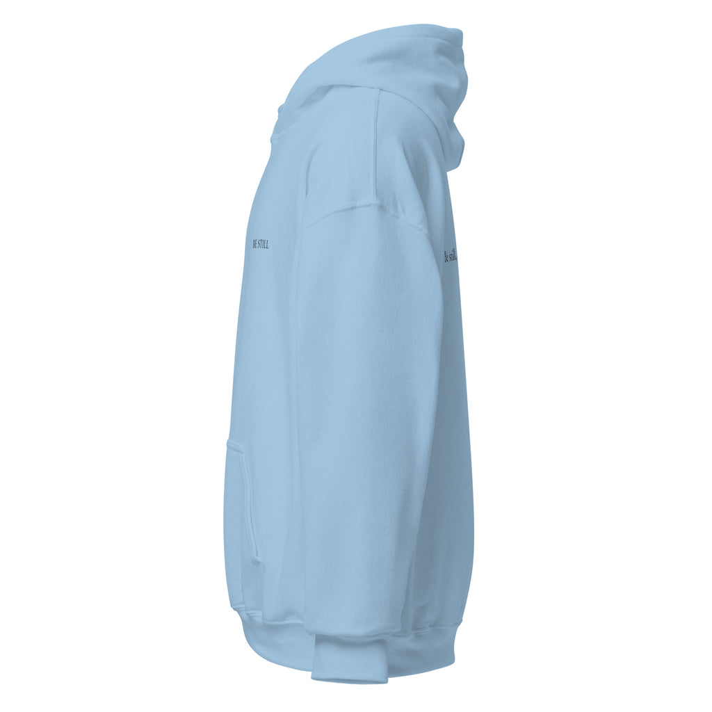 Light blue heavy blend fleece hoodie with small chest BE STILL quote, left side view