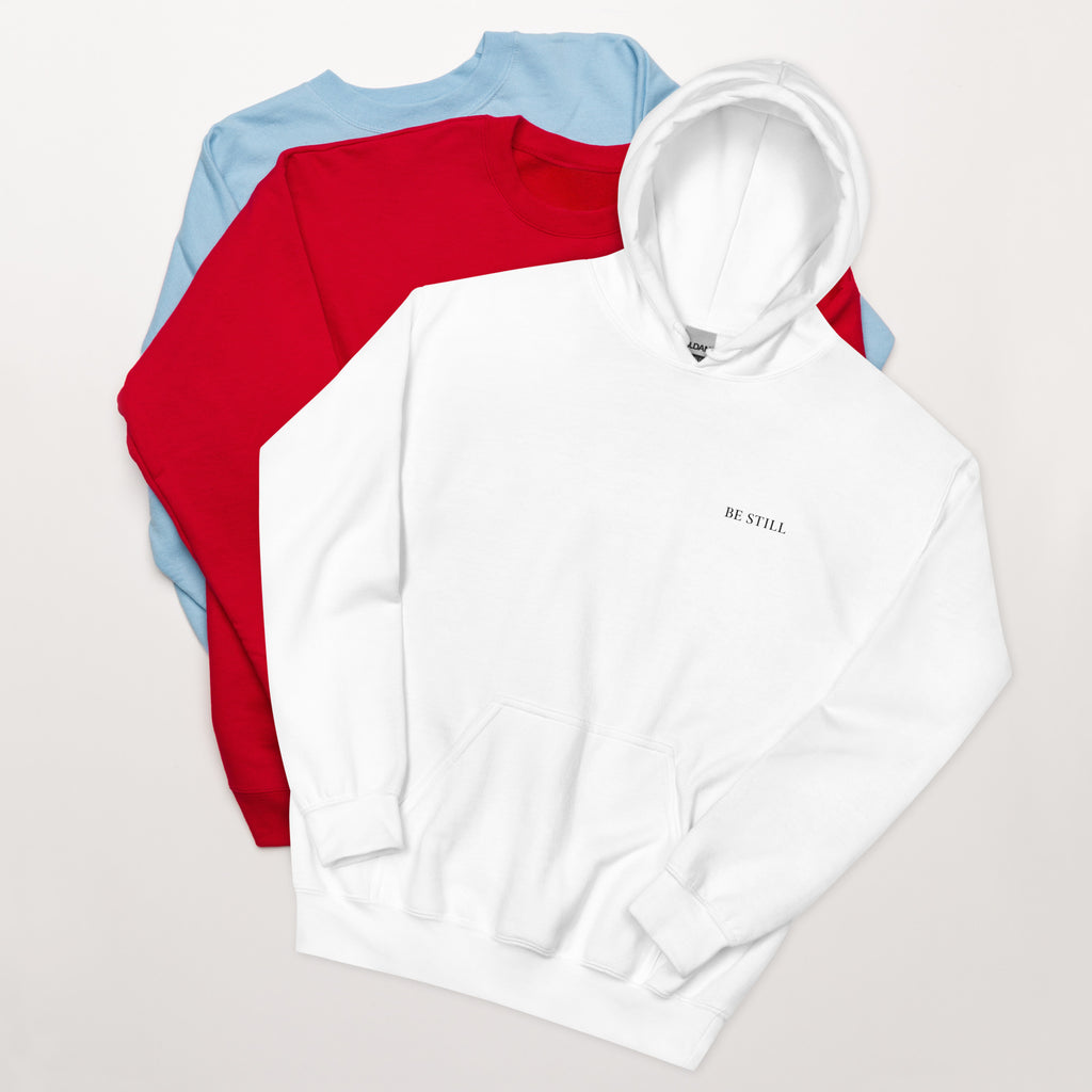White heavy blend fleece hoodie with small chest BE STILL quote, front detail