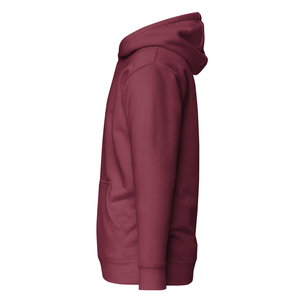 Maroon premium pullover hoodie with small chest BE STILL quote, left side view